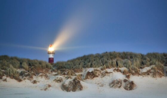 The lighthouse on Ameland Island in the Netherlands during the night.