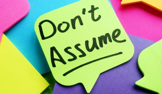 Don't Assume written on a piece of paper.