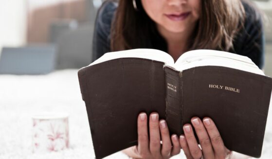 Woman reading the Bible.