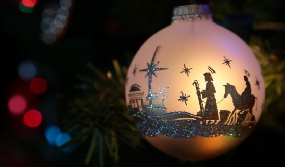Christmas ornament with nativity silhouette.