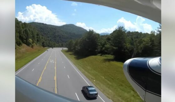 View from pilot's GoPro camera on emergency landing on highway.