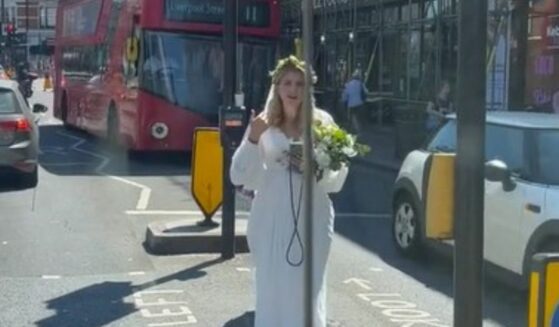 Screenshot of desperate bride waiting for taxi in London.