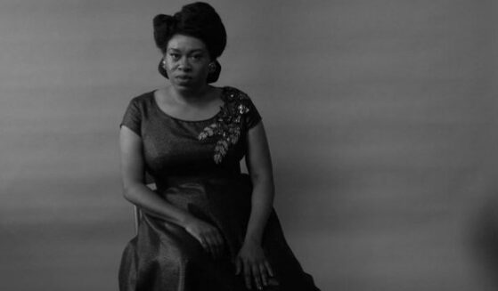 Shonka Dukureh sitting in chair.