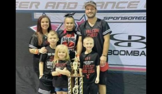 Tom and Lauren Dobosz and their 4 children at a cheer competition.