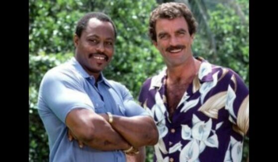 Roger E. Mosley and Tom Selleck, actors in Magnum PI, pose for a picture.