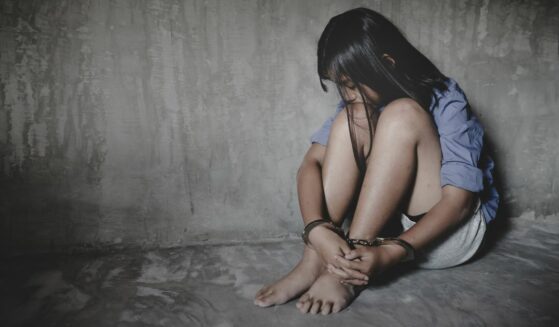 Handcuffed kidnapped child.