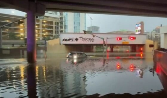 Woman's car submerged in flood waters in Dallas, Texas