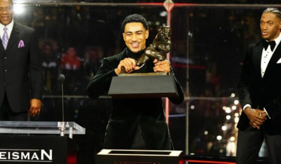 Bryce Young receives the Heisman Trophy.