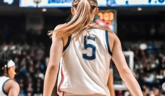 Paige Bueckers in basketball uniform on the court.