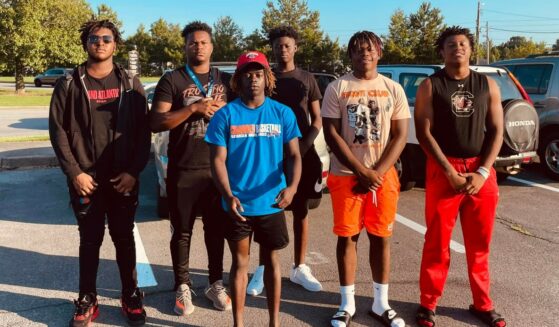 HS football players who saved a woman trapped in her car after a wreck.