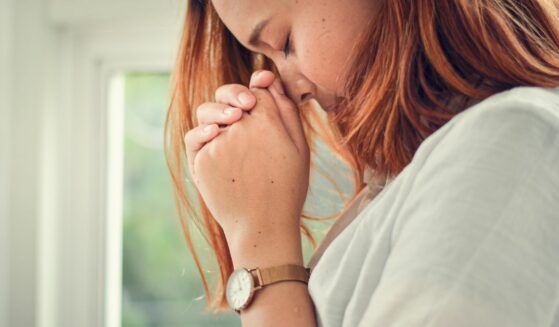 Woman praying to God from the Does God Hear Everyone's Prayers Article on Liftable.com