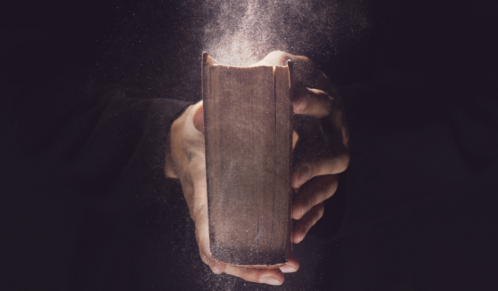 Photo of hands holding an old Bible from the Who Preached the First Gospel Message Article on Liftable.com
