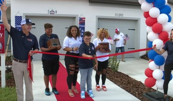 Gold Star family cuts ribbon in welcome home ceremony.