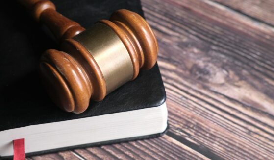 Close up of Gavel on a Book on Table