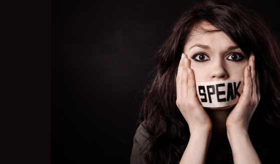 Woman with the word speak taped over her mouth from the Witnessing Requires Words Liftable.com article