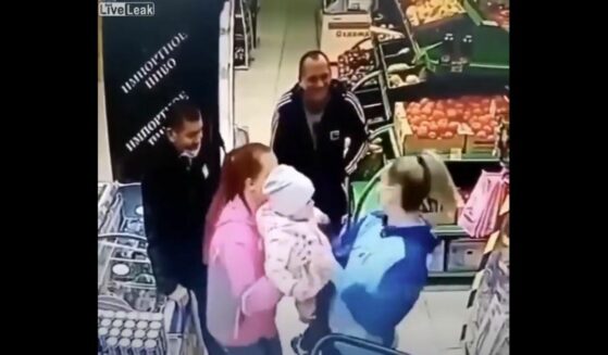 In the store's video footage, we see the mistaken mom calmly waiting in the check out line while another mother, smiling, removes the kid from her arms.