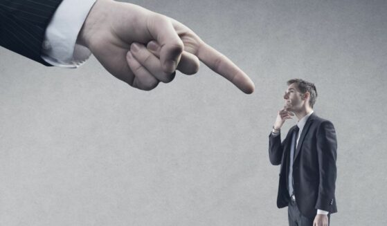 Authority, finger pointing at young man.