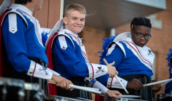 Michael Gouin, a deaf student, plays the snare drum in Woodson High School's marching band.
