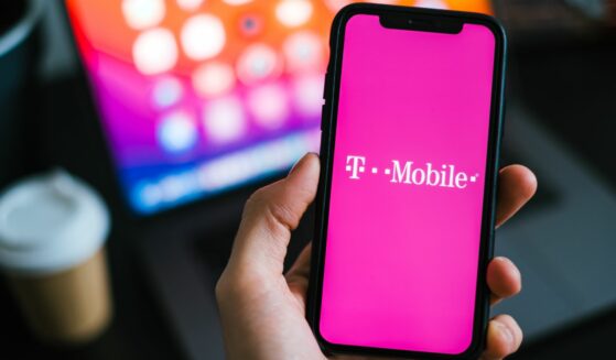 Rostov-on-Don, RUSSIA - February 15 2021: T-mobile logo on the smartphone screen in hand