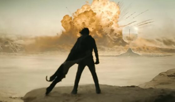 Screenshot of character in "Dune: Part Two" watching an explosion.