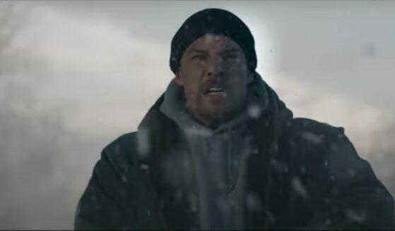 Alan Ritchson in snow storm in film "Ordinary Angels."