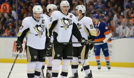NHL Hockey: Sidney Crosby and Evgeni Malkin, of the Pittsburgh Penguins during warm-ups. Penguins vs. New York Islanders at Nassau Coliseum on May 5, 2013.