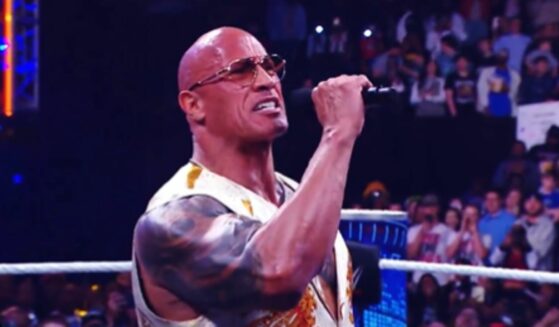 The Rock speaking before a wrestling match.